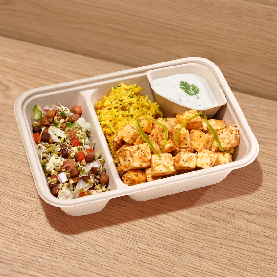 A FOJO tray of Arabian paneer with turmeric rice, a bean salad and a yogurt dip